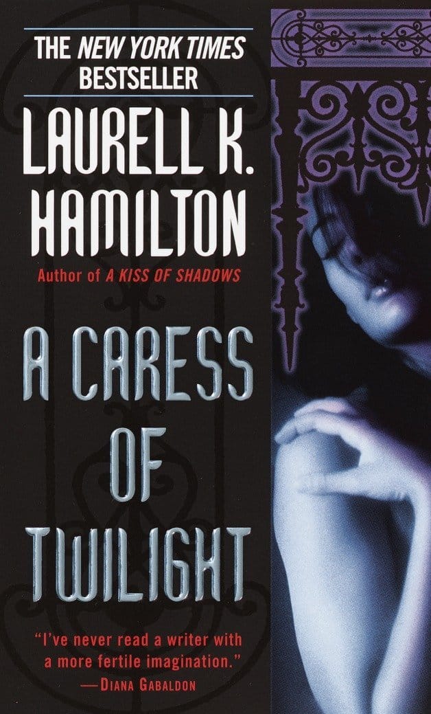 Paperback cover: A Caress of Twilight by Laurell K. Hamilton