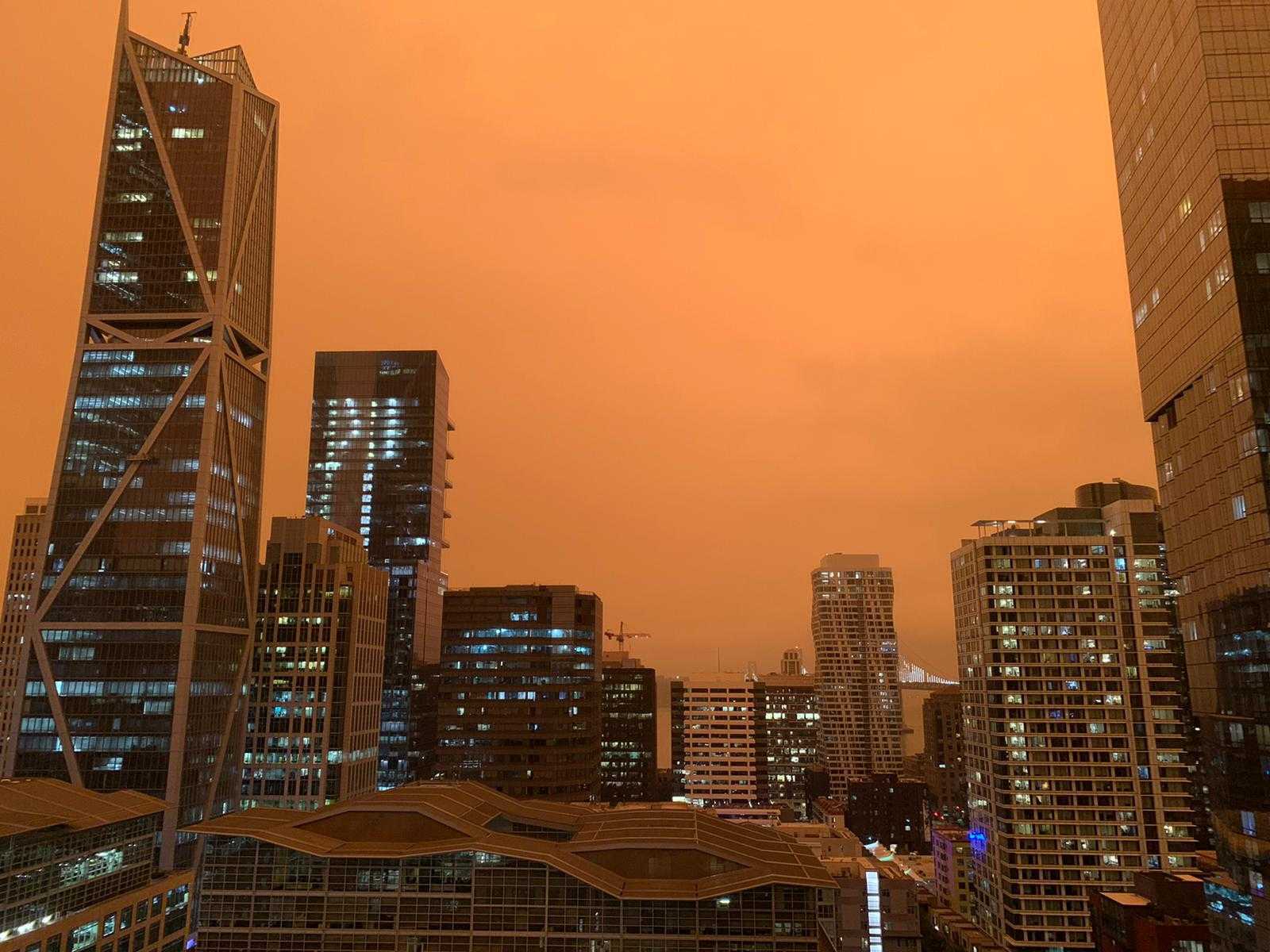 View of downtown San Francisco. Sky is orange from smoke, like Blade Runner.