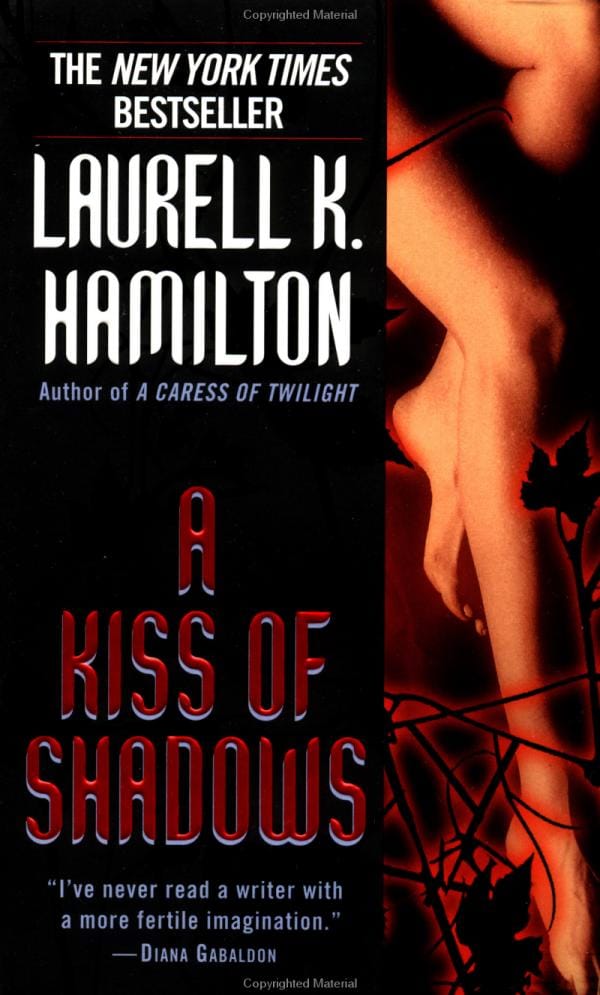 Paperback cover: A Kiss of Shadows by Laurell K. Hamilton